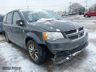 2014 Dodge Grand Caravan SE with VIN 2C4RDGBG8ER470014, listed as a IAAI auction lot 41553310 with 147,657 mi miles. Bid and sale history available at carsss.com. Image 1.