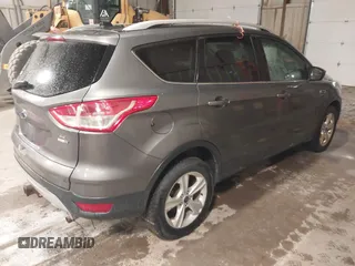 2014 Ford Escape SE with VIN 1FMCU9G95EUE19998, listed as a IAAI auction lot 42217195 with 163,934 mi miles and . Bid and sale history available at DreamBid. Image 4.