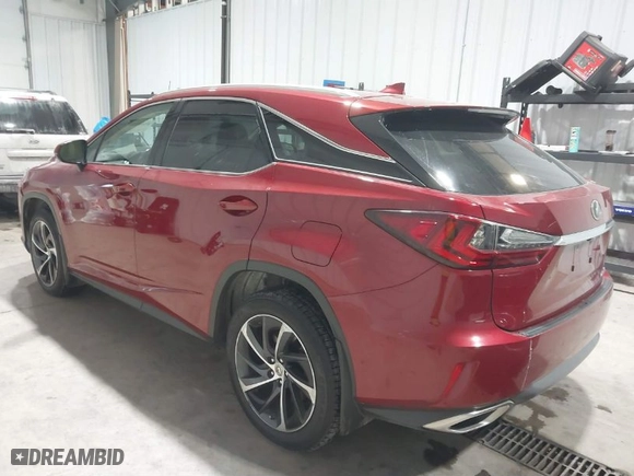 2017 Lexus RX with VIN 2T2BZMCA6HC112857, listed as a IAAI auction lot 41614059 with 100857 miles. Bid and sale history available at carsss.com. Image 3.