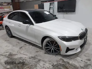 2019 BMW 3 Series 330i xDrive with VIN WBA5R7C55KAJ83482, listed as a IAAI auction lot 41565321 with 126,536 mi miles. Bid and sale history available at carsss.com. Image 1.