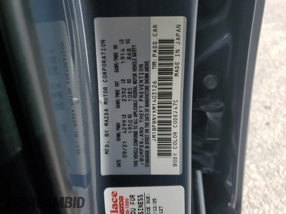2021 Mazda 3 Premium Plus with VIN JM1BPBNYXM1403126, listed as a Copart auction lot 59971535 with 56,952 mi miles and Salvage title. Bid and sale history available at DreamBid. Image 12.