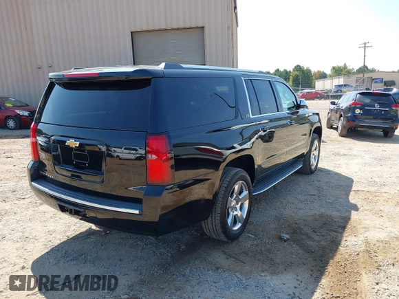 2015 Chevrolet Suburban LTZ with VIN 1GNSKKKC7FR205638, listed as a IAAI auction lot 40284367 with 103,530 mi miles and . Bid and sale history available at DreamBid. Image 4.