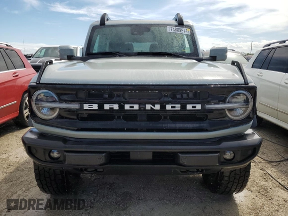 2021 Ford Bronco z VIN 1FMDE5CP4MLA65927, wystawiony jako Copart lot #74809974 z przebiegiem 41 296 mil mil oraz Nie do naprawy • Non repairable. Historia ofert i sprzedaży dostępna na DreamBid. Obrazek 5.
