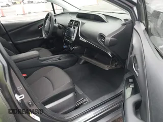 2021 Toyota Prius L Eco with VIN JTDKAMFUXM3143646, listed as a IAAI auction lot 41507110 with 207,238 mi miles. Bid and sale history available at carsss.com. Image 5.