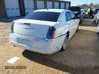 2014 Chrysler 300 with VIN 2C3CCAAGXEH377111, listed as a IAAI auction lot 41329879 with 147,680 mi miles. Bid and sale history available at carsss.com. Image 4.