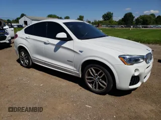 2015 BMW X4 xDrive28i with VIN 5UXXW3C53F0F89089, listed as a Copart auction lot 65869723 with 79,072 mi miles. Bid and sale history available at carsss.com. Image 4.