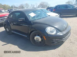 2013 Volkswagen Beetle 2.5L with VIN 3VWJP7AT1DM659562, listed as a IAAI auction lot 41913592 with 114,749 mi miles and . Bid and sale history available at DreamBid. Image 1.