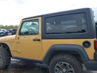 2014 Jeep Wrangler Rubicon with VIN 1C4BJWCG4EL145081, listed as a IAAI auction lot 42180723 with 113,659 mi miles and . Bid and sale history available at DreamBid. Image 14.