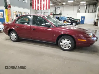 2002 Saturn SL with VIN 1G8ZH52822Z228302, listed as a Copart auction lot 58043985 with 153,058 mi miles and Salvage title. Bid and sale history available at DreamBid. Image 4.