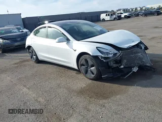 2019 Tesla Model 3 Mid Range with VIN 5YJ3E1EA6KF299990, listed as a IAAI auction lot 41765482 with 50,315 mi miles. Bid and sale history available at carsss.com. Image 1.