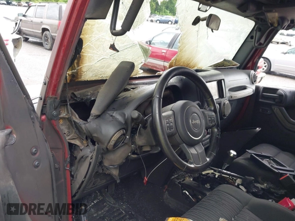 2012 Jeep Wrangler Sport with VIN 1C4AJWAG9CL203018, listed as a IAAI auction lot 42377899 with Not provided miles and . Bid and sale history available at DreamBid. Image 12.