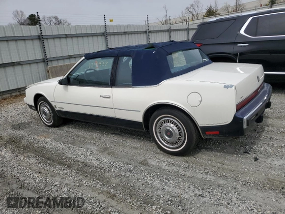 1987 Oldsmobile Toronado with VIN 1G3EZ1130HU307201, listed as a Copart auction lot 49290815 with 104,837 mi miles and Salvage Title. Bid and sale history available at DreamBid. Image 2.