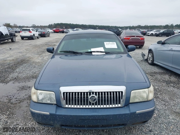 2007 Mercury Grand Marquis GS with VIN 2MEFM74V27X609128, listed as a IAAI auction lot 41474359 with 99,050 mi miles. Bid and sale history available at carsss.com. Image 12.