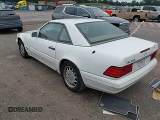 1997 Mercedes-Benz SL 500 z VIN WDBFA63F0VF146394, wystawiony jako IAAI lot #42308697 z przebiegiem 106 935 mil mil oraz . Historia ofert i sprzedaży dostępna na DreamBid. Obrazek 3.