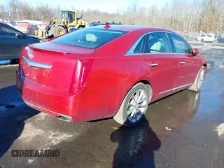 2014 Cadillac XTS Luxury z VIN 2G61N5S34E9163874, wystawiony jako IAAI lot #41649292 z przebiegiem 104 638 mil mil oraz . Historia ofert i sprzedaży dostępna na DreamBid. Obrazek 4.