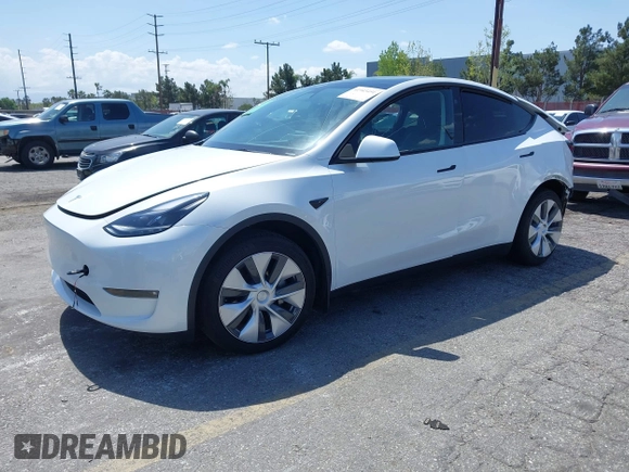 2023 Tesla Model Y Long Range with VIN 7SAYGAEE5PF855834, listed as a IAAI auction lot 41943491 with 34,480 mi miles. Bid and sale history available at carsss.com. Image 25.
