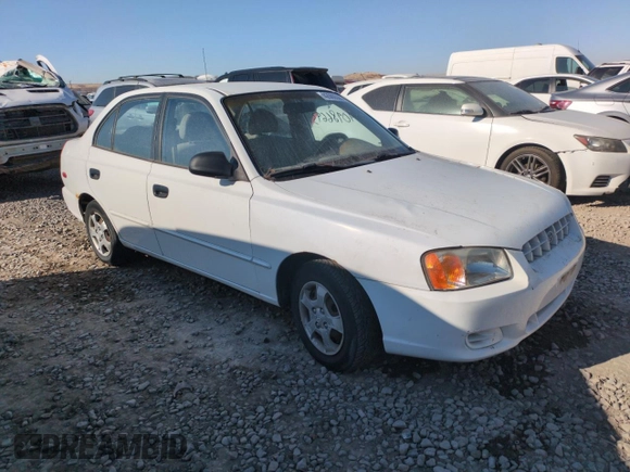 2000 Hyundai Accent z VIN KMHCG45G0YU084004, wystawiony jako Copart lot #42980585 z przebiegiem 167 545 mil mil oraz Czysty tytuł • Clean title. Historia ofert i sprzedaży dostępna na DreamBid. Obrazek 4.