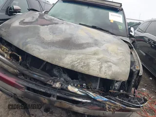 2003 Chevrolet Tahoe LS z VIN 1GNEC13Z73J164865, wystawiony jako IAAI lot #42213688 z przebiegiem Nie podano mil oraz . Historia ofert i sprzedaży dostępna na DreamBid. Obrazek 6.