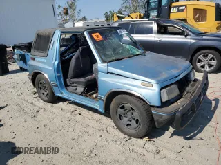1995 Geo Tracker z VIN 2CNBE18UXS6930601, wystawiony jako Copart lot #76079094 z przebiegiem 276 136 mil mil oraz Szkody całkowita. Historia ofert i sprzedaży dostępna na DreamBid. Obrazek 4.