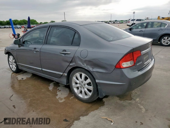 2010 Honda Civic LX with VIN 2HGFA1F52AH315977, listed as a Copart auction lot 54240115 with 217,883 mi miles and Salvage Title. Bid and sale history available at DreamBid. Image 2.