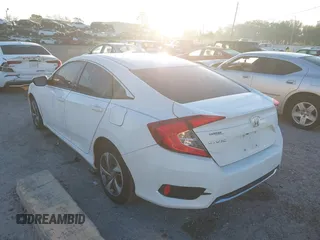 2019 Honda Civic LX with VIN 19XFC2F61KE014007, listed as a IAAI auction lot 41795070 with 64,259 mi miles and . Bid and sale history available at DreamBid. Image 3.