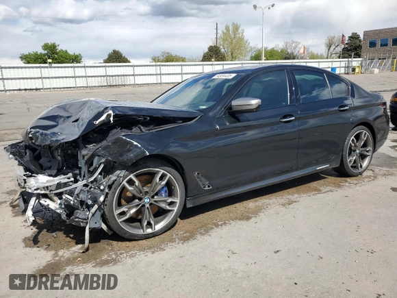 2018 BMW 5 Series M550i xDrive with VIN WBAJB9C55JB049384, listed as a Copart auction lot 54934435 with 79,061 mi miles and Non Repairable. Bid and sale history available at DreamBid. Image 1.