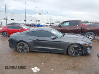 2018 Ford Mustang EcoBoost z VIN 1FA6P8TH2J5184485, wystawiony jako IAAI lot #41884810 z przebiegiem 74 999 mil mil oraz . Historia ofert i sprzedaży dostępna na DreamBid. Obrazek 13.