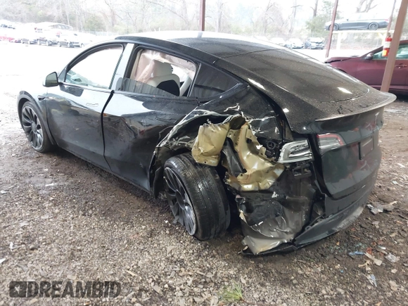 2023 Tesla Model Y Performance with VIN 7SAYGDEF2PF800641, listed as a IAAI auction lot 41612596 with 60,984 mi miles and . Bid and sale history available at DreamBid. Image 3.