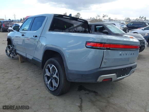 2023 Rivian R1T Adventure with VIN 7FCTGBAA9PN027894, listed as a IAAI auction lot 42061339 with 5,047 mi miles. Bid and sale history available at carsss.com. Image 3.