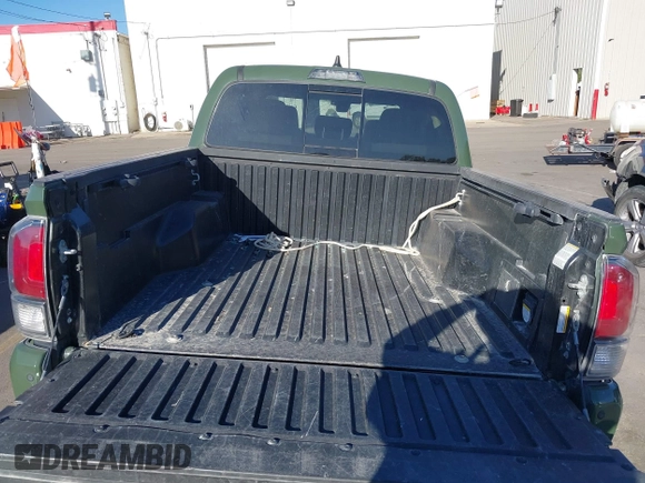 2021 Toyota Tacoma SR with VIN 3TYCZ5AN2MT039450, listed as a IAAI auction lot 40457613 with 54,176 mi miles and . Bid and sale history available at DreamBid. Image 16.