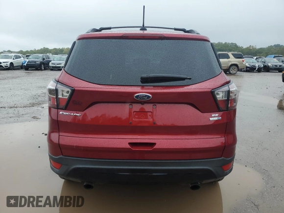2018 Ford Escape SE z VIN 1FMCU9GD4JUA49819, wystawiony jako Copart lot #73023734 z przebiegiem 96 228 mil mil oraz Szkody całkowita. Historia ofert i sprzedaży dostępna na DreamBid. Obrazek 6.