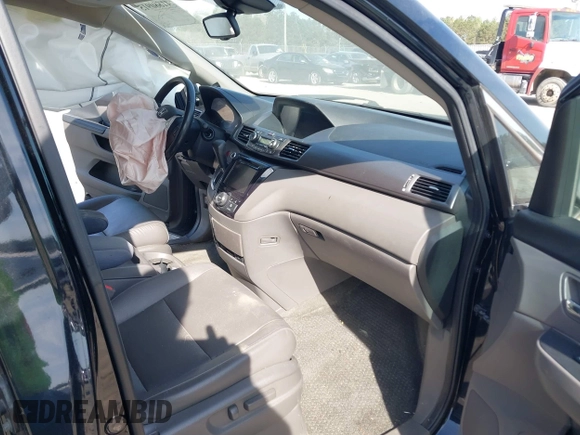 2015 Honda Odyssey EX-L with VIN 5FNRL5H65FB088106, listed as a IAAI auction lot 41880915 with 176,539 mi miles and . Bid and sale history available at carsss.com. Image 5.