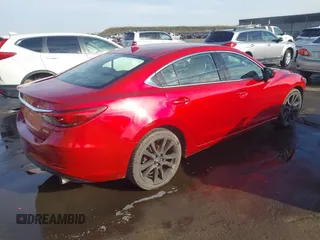 2016 Mazda 6 i Grand Touring with VIN JM1GJ1W57G1438524, listed as a IAAI auction lot 41365211 with 162,678 mi miles and . Bid and sale history available at DreamBid. Image 4.