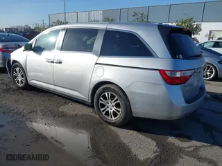 2011 Honda Odyssey EX-L with VIN 5FNRL5H6XBB057556, listed as a IAAI auction lot 41808620 with 154,449 mi miles. Bid and sale history available at carsss.com. Image 3.