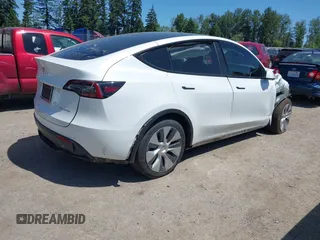 2022 Tesla Model Y Long Range z VIN 7SAYGDEE9NF509655, wystawiony jako IAAI lot #42433796 z przebiegiem 46 936 mil mil oraz . Historia ofert i sprzedaży dostępna na DreamBid. Obrazek 4.