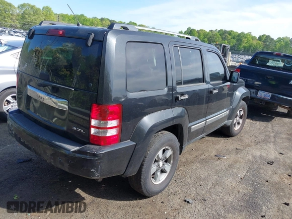 2008 Jeep Liberty Sport with VIN 1J8GP28KX8W227953, listed as a IAAI auction lot 42049588 with 310,901 mi miles. Bid and sale history available at carsss.com. Image 4.