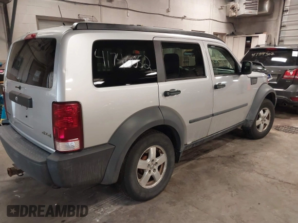 2007 Dodge Nitro SXT with VIN 1D8GU28K47W569317, listed as a IAAI auction lot 41740052 with 220,265 mi miles. Bid and sale history available at carsss.com. Image 4.