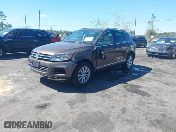 2014 Volkswagen Touareg Sport with VIN WVGEF9BP7ED003525, listed as a IAAI auction lot 41868307 with 74,379 mi miles and . Bid and sale history available at DreamBid. Image 17.