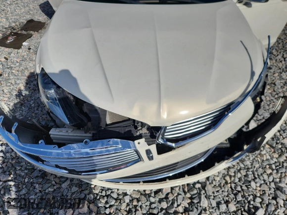 2013 Lincoln MKZ z VIN 3LN6L2GK1DR816558, wystawiony jako Copart lot #60424415 z przebiegiem 95 593 mil mil oraz Szkoda całkowita • Salvage title. Historia ofert i sprzedaży dostępna na DreamBid. Obrazek 11.