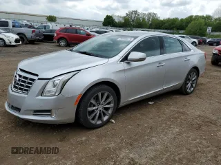 2013 Cadillac XTS z VIN 2G61N5S37D9130494, wystawiony jako Copart lot #56900075 z przebiegiem 81 653 mil mil oraz Czysty tytuł • Clean title. Historia ofert i sprzedaży dostępna na DreamBid. Obrazek 1.