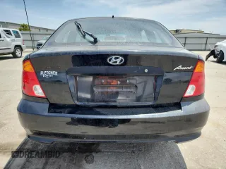 2003 Hyundai Accent GL z VIN KMHCG35C33U258812, wystawiony jako Copart lot #57509245 z przebiegiem 153 716 mil mil oraz Szkoda całkowita • Salvage title. Historia ofert i sprzedaży dostępna na DreamBid. Obrazek 6.