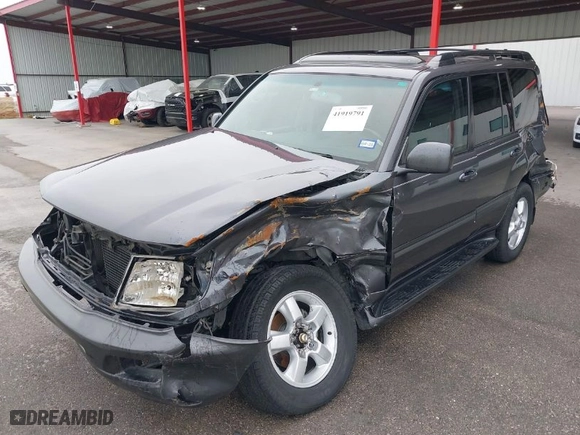 2004 Toyota Land Cruiser with VIN JTEHT05JX42059414, listed as a IAAI auction lot 41919791 with 210,528 mi miles. Bid and sale history available at carsss.com. Image 6.