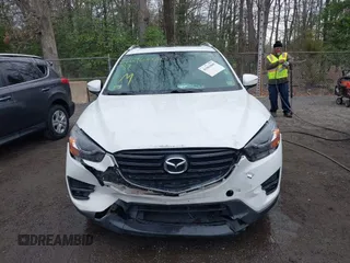 2016 Mazda CX-5 Grand Touring with VIN JM3KE4DY3G0838204, listed as a IAAI auction lot 41961049 with 98,918 mi miles and . Bid and sale history available at carsss.com. Image 12.