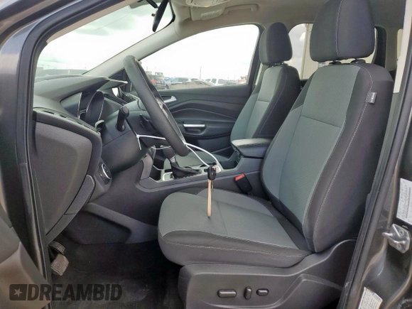 2017 Ford Escape SE z VIN 1FMCU9G91HUE17654, wystawiony jako Copart lot #56173175 z przebiegiem 97 678 mil mil oraz Czysty tytuł • Clean title. Historia ofert i sprzedaży dostępna na DreamBid. Obrazek 7.