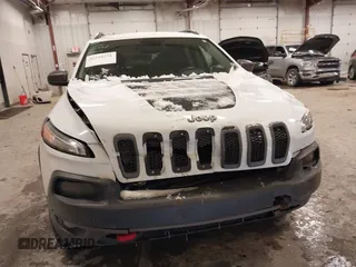 2014 Jeep Cherokee Trailhawk with VIN 1C4PJMBS5EW159912, listed as a IAAI auction lot 41538254 with 166,955 mi miles. Bid and sale history available at carsss.com. Image 6.