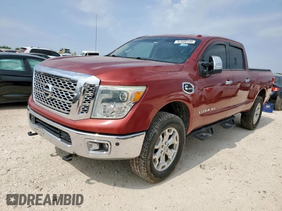 2016 Nissan Titan SL z VIN 1N6BA1F4XGN500750, wystawiony jako Copart lot #57608135 z przebiegiem 126 525 mil mil oraz Czysty tytuł • Clean title. Historia ofert i sprzedaży dostępna na DreamBid. Obrazek 1.