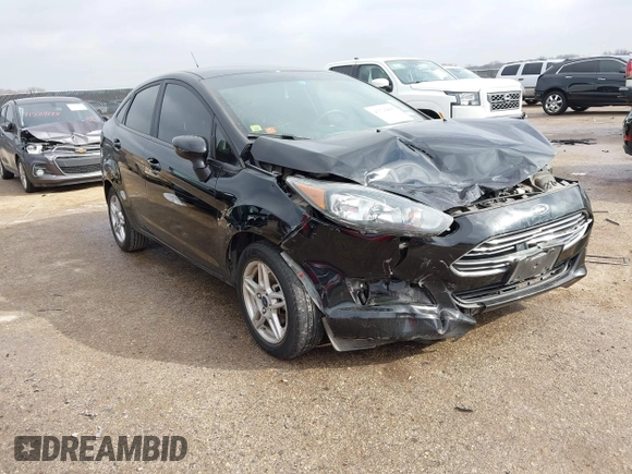 2019 Ford Fiesta SE z VIN 3FADP4BJ7KM158142, wystawiony jako IAAI lot #41510806 z przebiegiem 55 315 mil mil oraz . Historia ofert i sprzedaży dostępna na DreamBid. Obrazek 1.