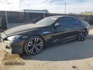 2015 BMW 6 Series 650i xDrive z VIN WBAYM1C55FD325245, wystawiony jako Copart lot #88049055 z przebiegiem 59 583 mil mil oraz Szkoda całkowita • Salvage title. Historia ofert i sprzedaży dostępna na DreamBid. Obrazek 1.