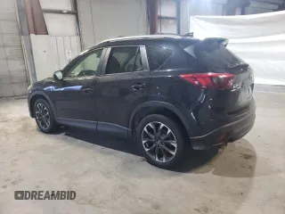 2016 Mazda CX-5 Grand Touring with VIN JM3KE4DY6G0655802, listed as a Copart auction lot 43820475 with 76,639 mi miles and Salvage Title. Bid and sale history available at carsss.com. Image 2.