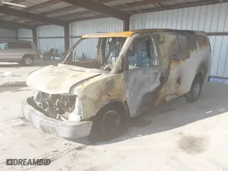 2019 Chevrolet Express Cargo Van with VIN 1GCWGAFP1K1163575, listed as a IAAI auction lot 41412575 with 266,818 mi miles. Bid and sale history available at carsss.com. Image 2.